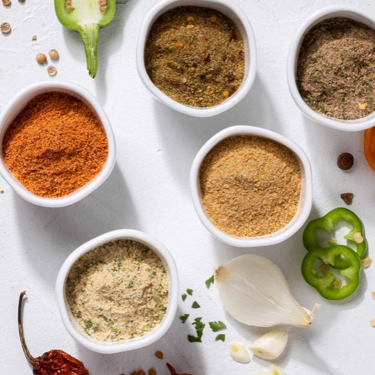 Above shot of styled ofi spices decorated with fruits